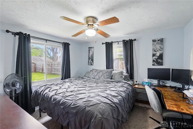 813 Kenosha Rd, Kettering, OH 45429 - bedroom with carpet floors, a ceiling fan, and a textured ceiling