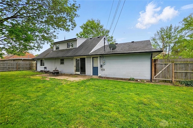 813 Kenosha Rd, Kettering, OH 45429 - rear view of property with a fenced backyard, a yard, a patio area, and roof with shingles