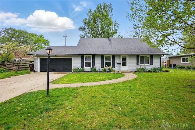 813 Kenosha Rd, Kettering, OH 45429 - single story home with a garage, a front lawn, fence, central air condition unit, and driveway