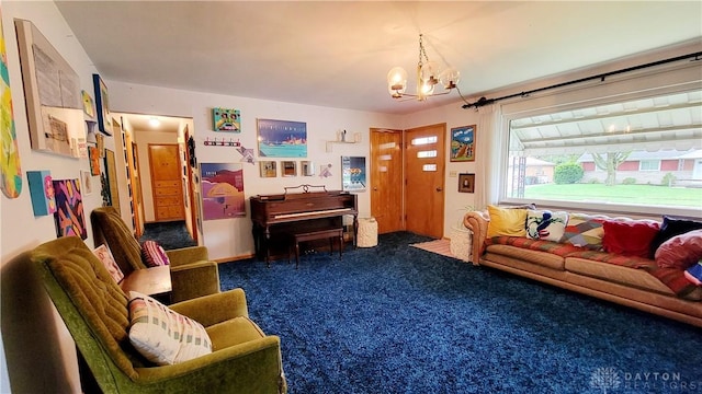 living room with an inviting chandelier and carpet flooring