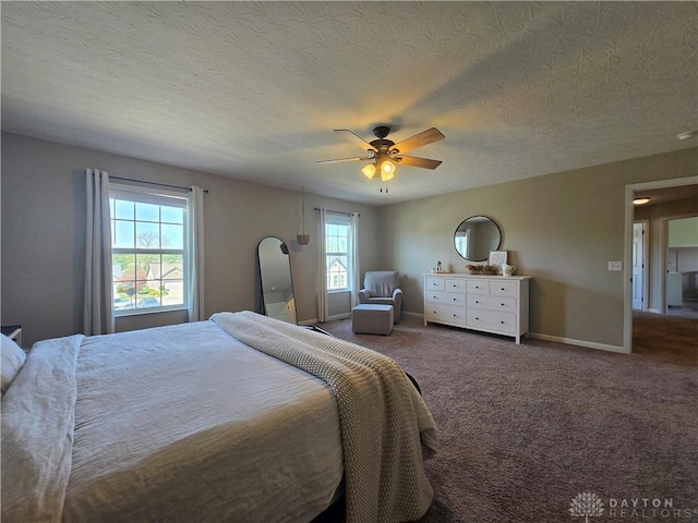 bedroom featuring carpet flooring, a ceiling fan, a textured ceiling, and baseboards