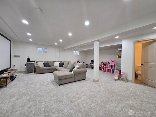 living room with recessed lighting, carpet flooring, baseboards, and visible vents