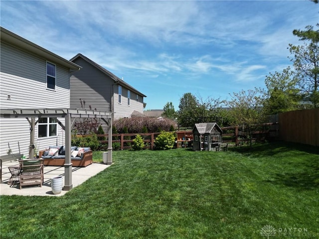 view of yard with a patio, a pergola, an outdoor living space, and a fenced backyard