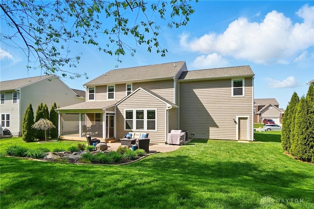 1152 Sarah Freeman Dr, Dayton, OH 45458 - rear view of property with an outdoor hangout area, a sunroom, central AC unit, a patio, and a yard