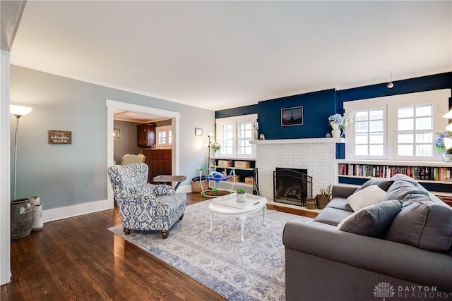 94 Patterson Rd, Oakwood, OH 45419 - living area with crown molding, baseboards, wood finished floors, and a fireplace