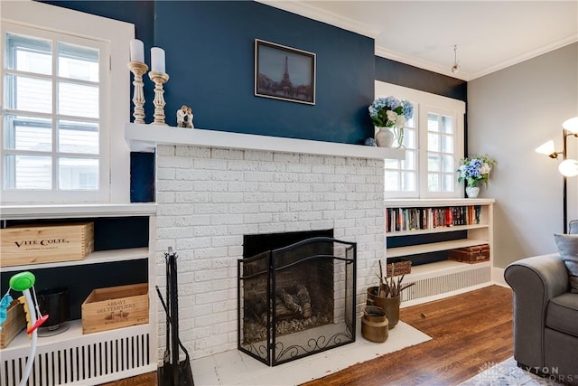 94 Patterson Rd, Oakwood, OH 45419 - living room with ornamental molding, a brick fireplace, and wood finished floors