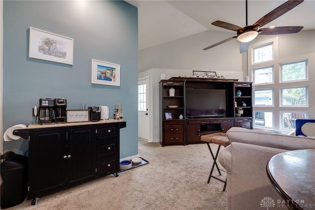 94 Patterson Rd, Oakwood, OH 45419 - living area with light colored carpet, a ceiling fan, plenty of natural light, and vaulted ceiling