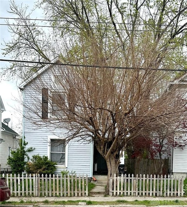 view of side of property with a fenced front yard