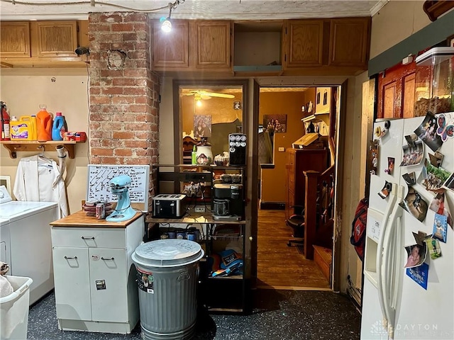 interior space with brown cabinetry, white refrigerator with ice dispenser, and washer / clothes dryer