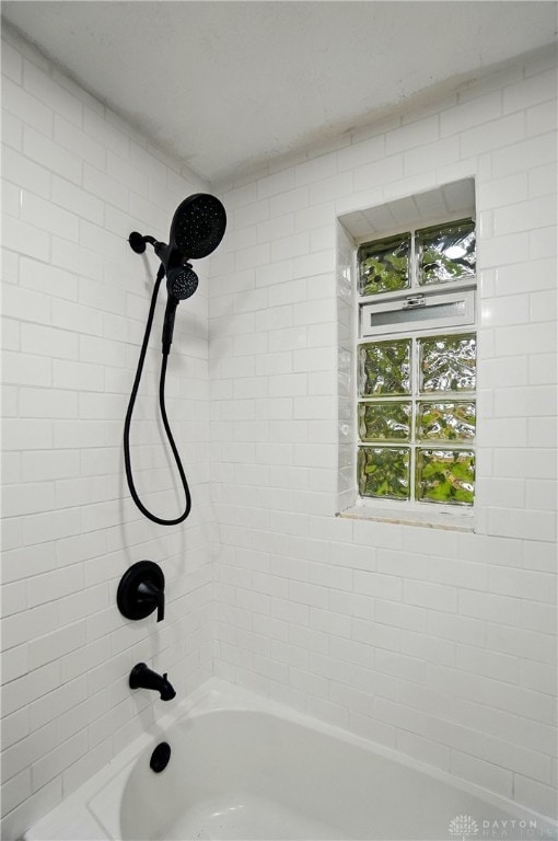 bathroom featuring  shower combination