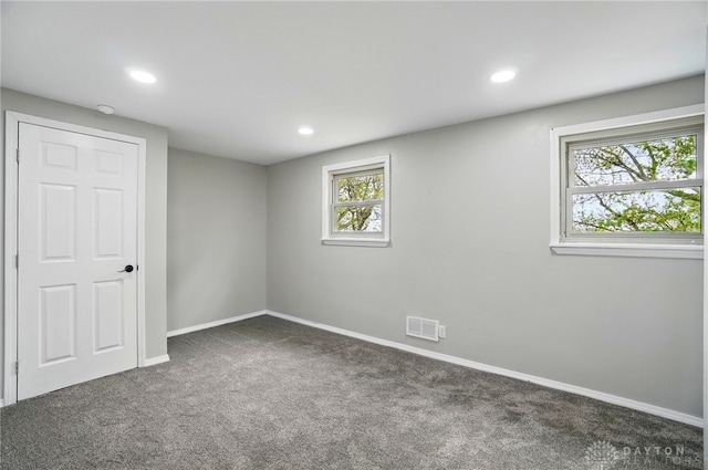 interior space featuring visible vents, recessed lighting, carpet, and baseboards