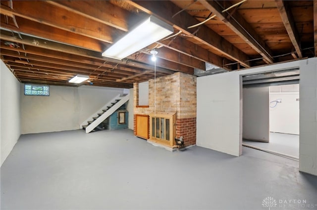 basement featuring stairs