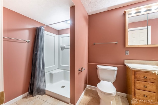 full bathroom featuring toilet, baseboards, a shower stall, and vanity