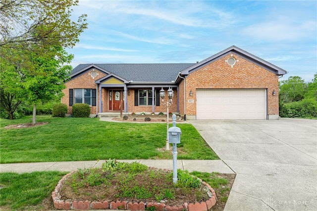single story home with a garage, driveway, a front lawn, and brick siding
