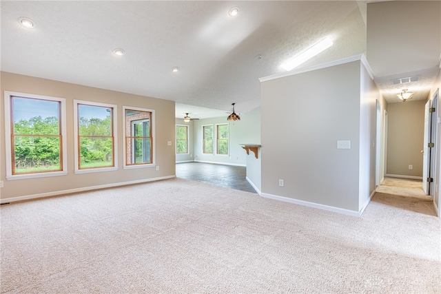 carpeted empty room featuring baseboards, ornamental molding, recessed lighting, and visible vents