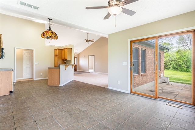 unfurnished living room featuring visible vents, a ceiling fan, baseboards, and lofted ceiling