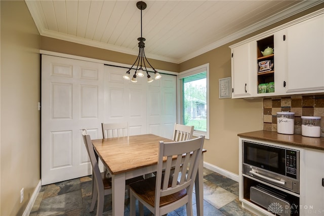 2661 Powhattan Pl, Dayton, OH 45420 - dining space featuring wood ceiling, baseboards, a notable chandelier, ornamental molding, and stone tile floors