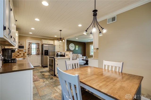 2661 Powhattan Pl, Dayton, OH 45420 - dining space with a wealth of natural light, ornamental molding, recessed lighting, and visible vents