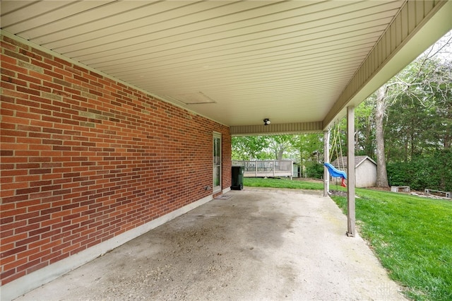 2661 Powhattan Pl, Dayton, OH 45420 - view of patio / terrace with a storage shed, an outdoor structure, and a carport