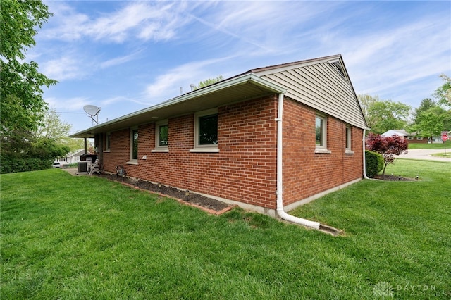 2661 Powhattan Pl, Dayton, OH 45420 - view of side of property featuring brick siding and a yard