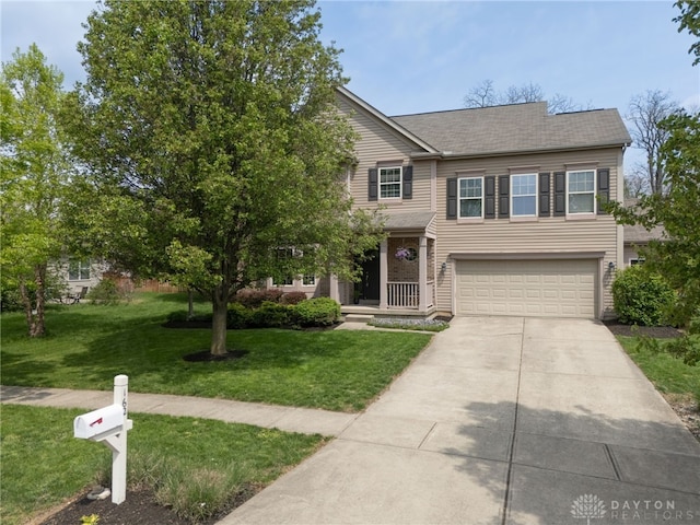 view of front of house with a garage, a shingled roof, a front yard, and concrete driveway