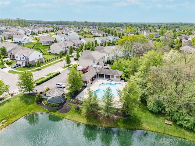 bird's eye view with a water view and a residential view