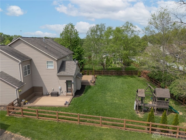 exterior space with a fenced backyard, central AC, and a deck