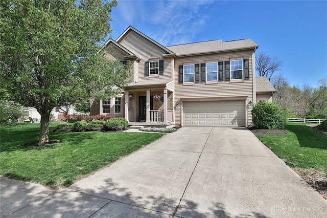 traditional home featuring a garage, concrete driveway, a porch, and a front lawn