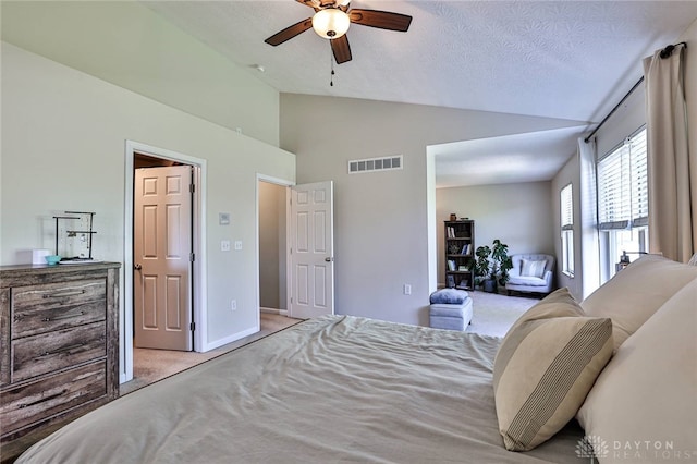 bedroom with light colored carpet, high vaulted ceiling, a ceiling fan, baseboards, and visible vents