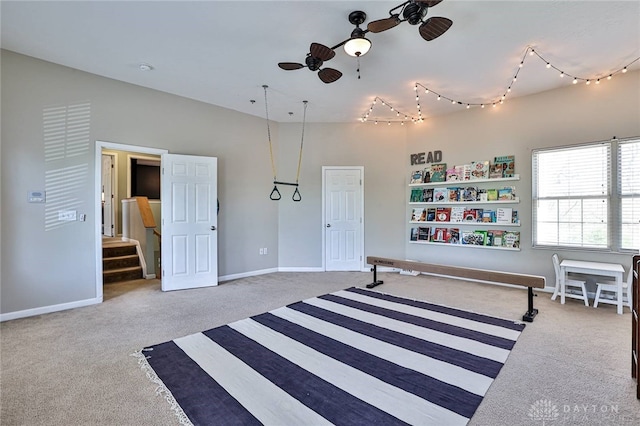 bedroom featuring track lighting, baseboards, and carpet flooring