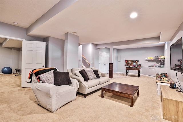 living area with stairway, carpet floors, and baseboards