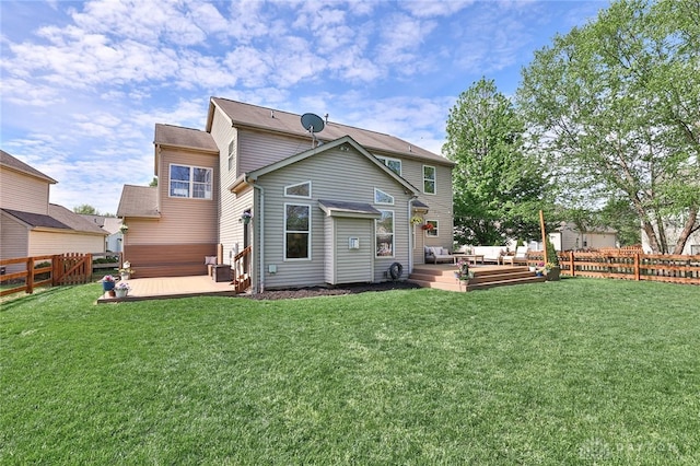 back of house featuring a fenced backyard, a wooden deck, and outdoor lounge area