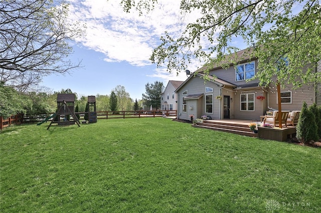 view of yard featuring a fenced backyard and a deck