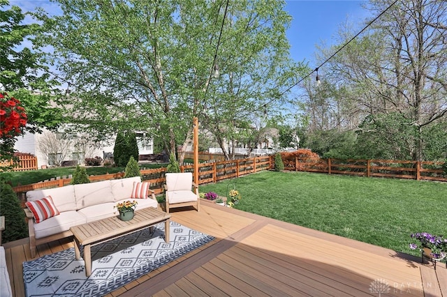 deck with a fenced backyard, a yard, and outdoor lounge area