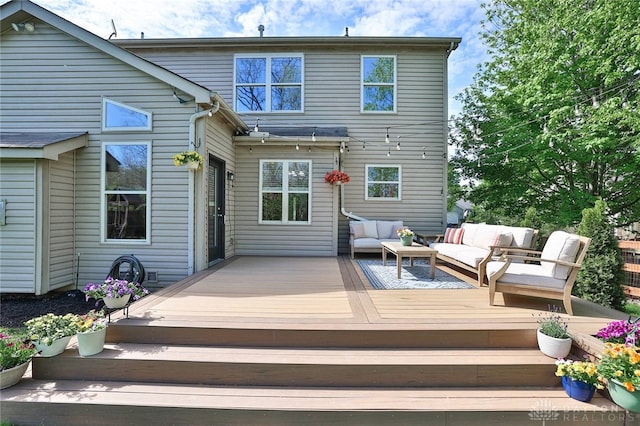 back of property with a deck and outdoor lounge area