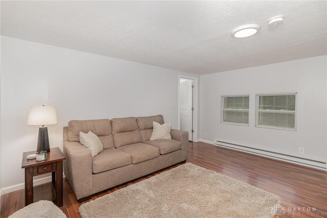 12 N Water St, Lebanon, OH 45036 - living room with wood finished floors, baseboards, and a baseboard heating unit