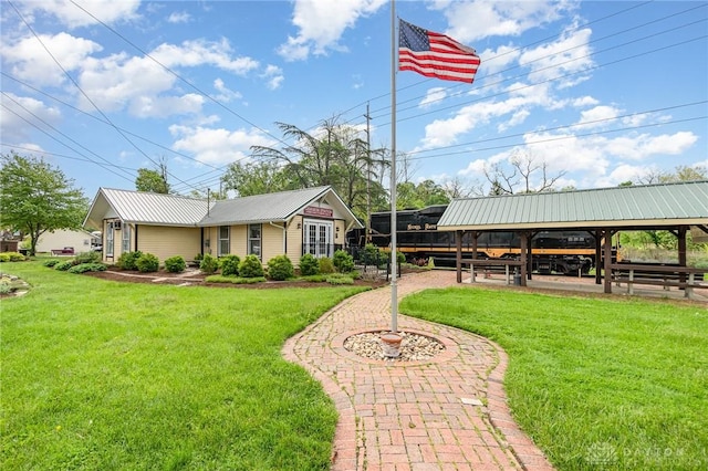 12 N Water St, Lebanon, OH 45036 - view of front of house with metal roof, a front yard, and a gazebo