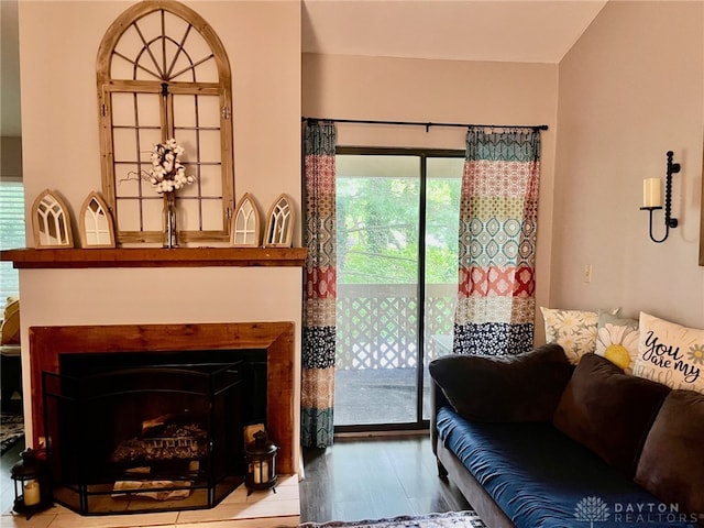living room featuring a fireplace and wood finished floors