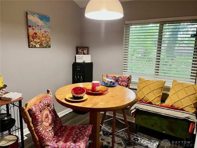 dining space featuring wood finished floors