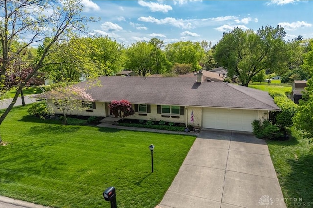 ranch-style home featuring driveway, a chimney, a front lawn, and a garage