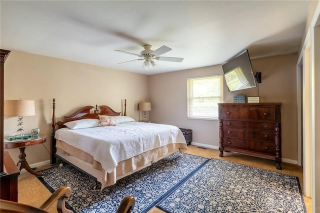 bedroom featuring baseboards and ceiling fan