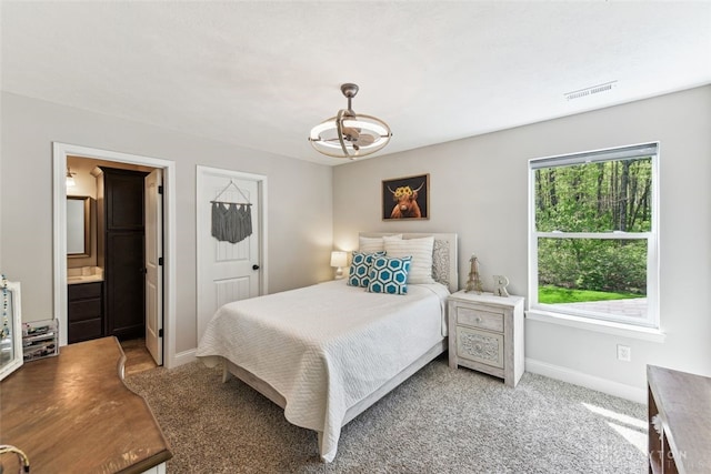 2187 Hamilton Rd, Lebanon, OH 45036 - bedroom with visible vents, baseboards, a chandelier, and light colored carpet