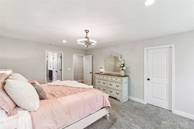 2187 Hamilton Rd, Lebanon, OH 45036 - bedroom with light colored carpet, an inviting chandelier, recessed lighting, baseboards, and ensuite bathroom