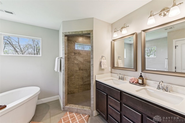 2187 Hamilton Rd, Lebanon, OH 45036 - full bath with visible vents, a tile shower, and a sink