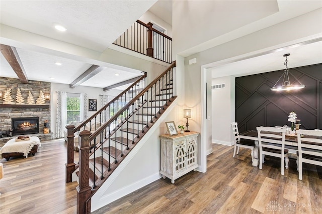 2187 Hamilton Rd, Lebanon, OH 45036 - stairs featuring baseboards, wood finished floors, and visible vents