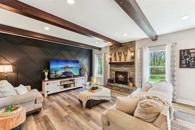 2187 Hamilton Rd, Lebanon, OH 45036 - living room with plenty of natural light, baseboards, wood finished floors, and a stone fireplace