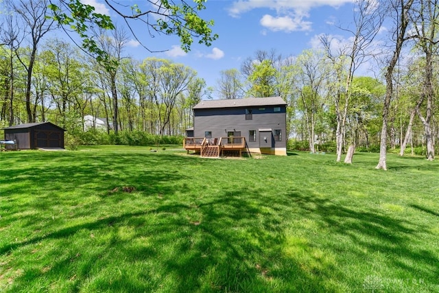 2187 Hamilton Rd, Lebanon, OH 45036 - rear view of property featuring a lawn, a storage unit, an outbuilding, and a deck