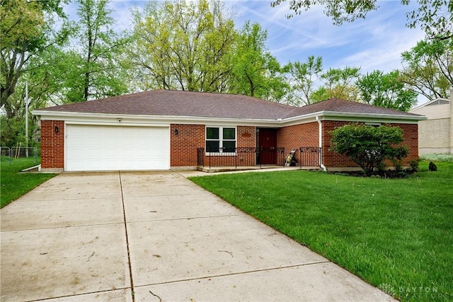 3600 Honeybrook Ave, Dayton, OH 45415 - single story home featuring a front yard, roof with shingles, brick siding, concrete driveway, and an attached garage