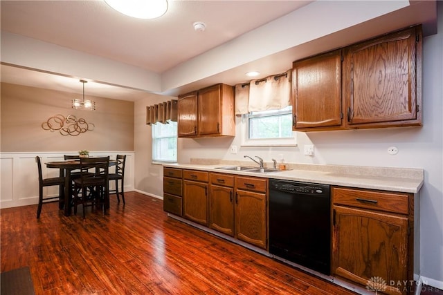 3600 Honeybrook Ave, Dayton, OH 45415 - kitchen with black dishwasher, dark wood finished floors, a sink, and light countertops