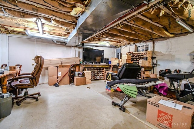 unfinished basement with a workshop area